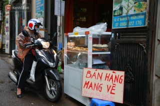 Ngày đầu nới lỏng giãn cách xã hội ở Hà Nội: Nhiều quán ăn vẫn đóng cửa vì sợ lỗ chồng lỗ, quán mở cửa lại vắng bóng khách - Ảnh 3.