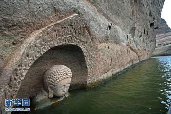 Hạn hán nghiêm trọng khiến hồ chứa cạn nước, lộ ra đầu tượng Phật khổng lồ: Bí mật vẫn còn nằm bên dưới - Ảnh 5.