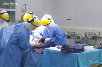 Phẫu thuật mổ lấy thai cho sản phụ dương tính virus SARS-CoV-2 tại khu cách ly Bệnh viện Sản Nhi Quảng Ninh - Ảnh 2.