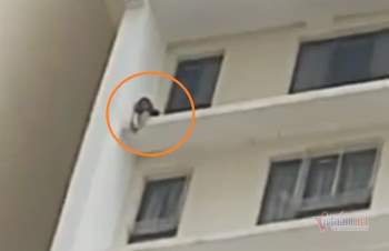 Giải cứu cô gái leo ra lan can định nhảy từ tầng cao chung cư Tu tu - Ảnh 1.