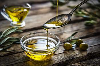 pouring-extra-virgin-olive-oil-royalty-free-image-1597238508.jpg